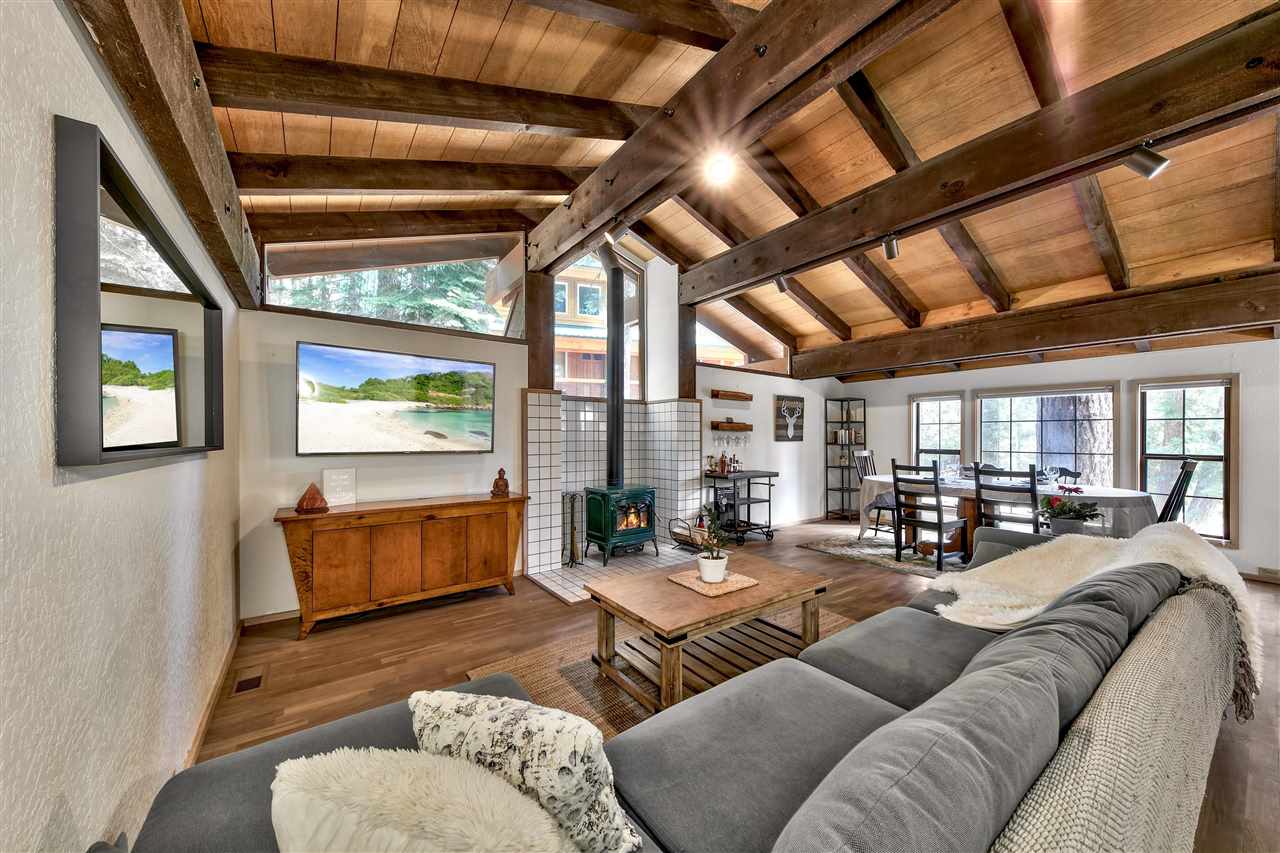 11576 Chamonix Road Truckee, CA 96161 - Photo 6 of 21 a living room with furniture and a flat screen tv