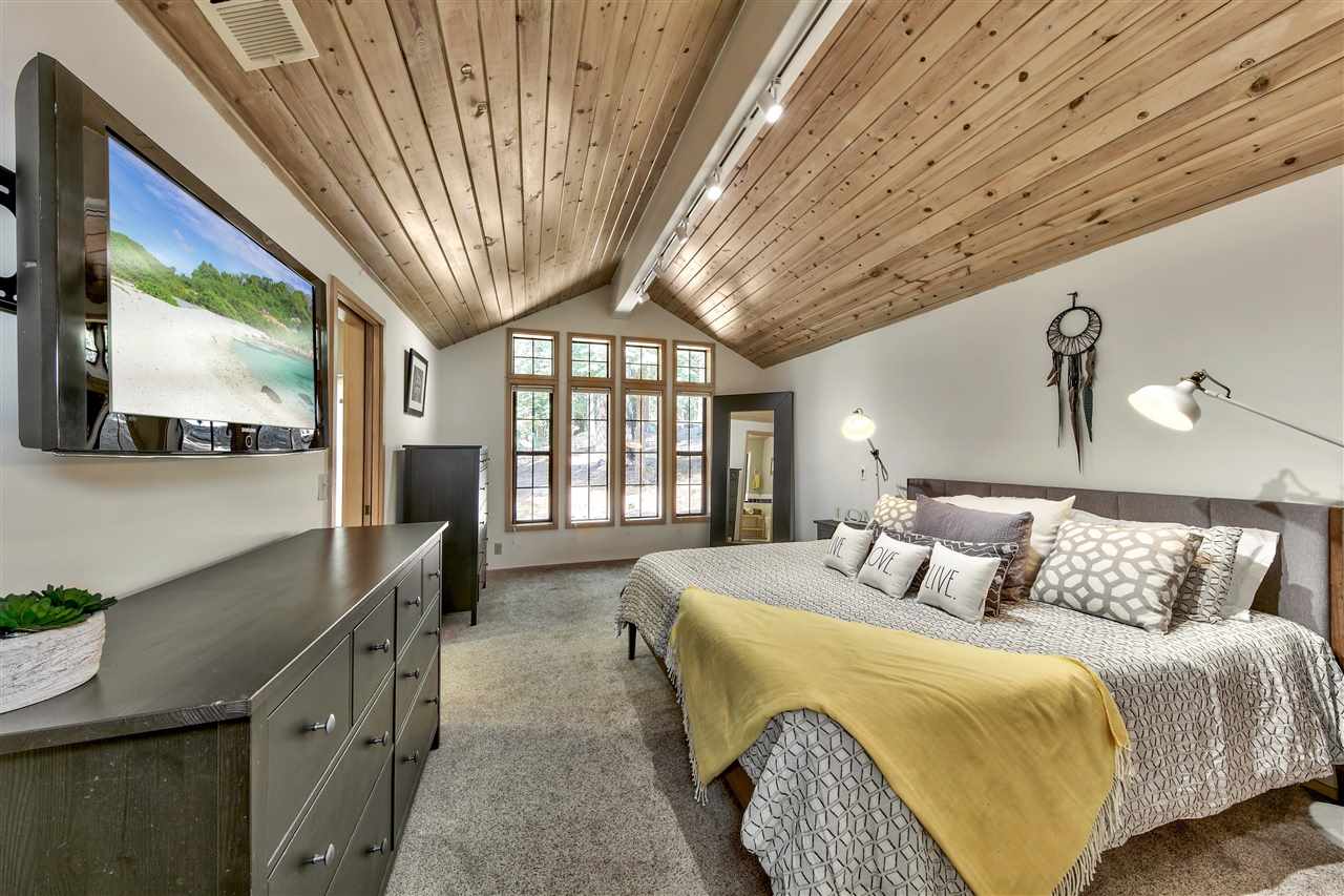 11576 Chamonix Road Truckee, CA 96161 - Photo 10 of 21 a bedroom with a large bed and a large window