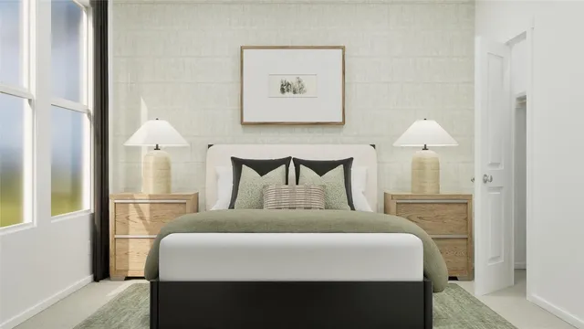 a bedroom with a bed and a lamp