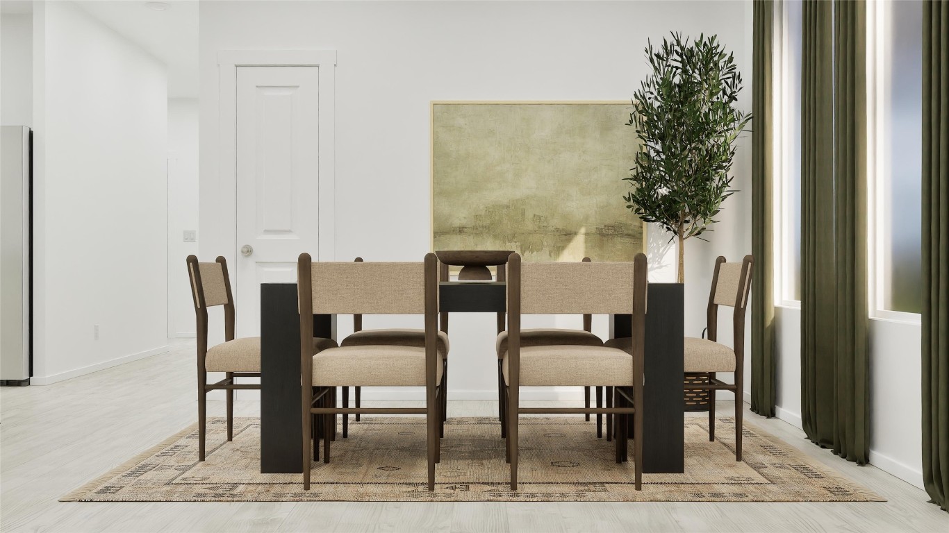 13301 Winton Drive Elgin, TX 78621 - Photo 10 of 25 a view of a dining room with furniture and a potted plant