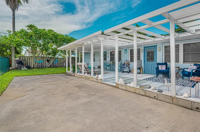 a outdoor space with lots of furniture and a chandelier