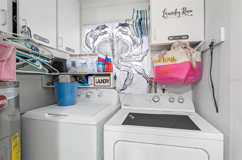 331 Hernando Street, Unit S 123 Fort Pierce, FL 34949 - Photo 26 of 52 a utility room with dryer and washer