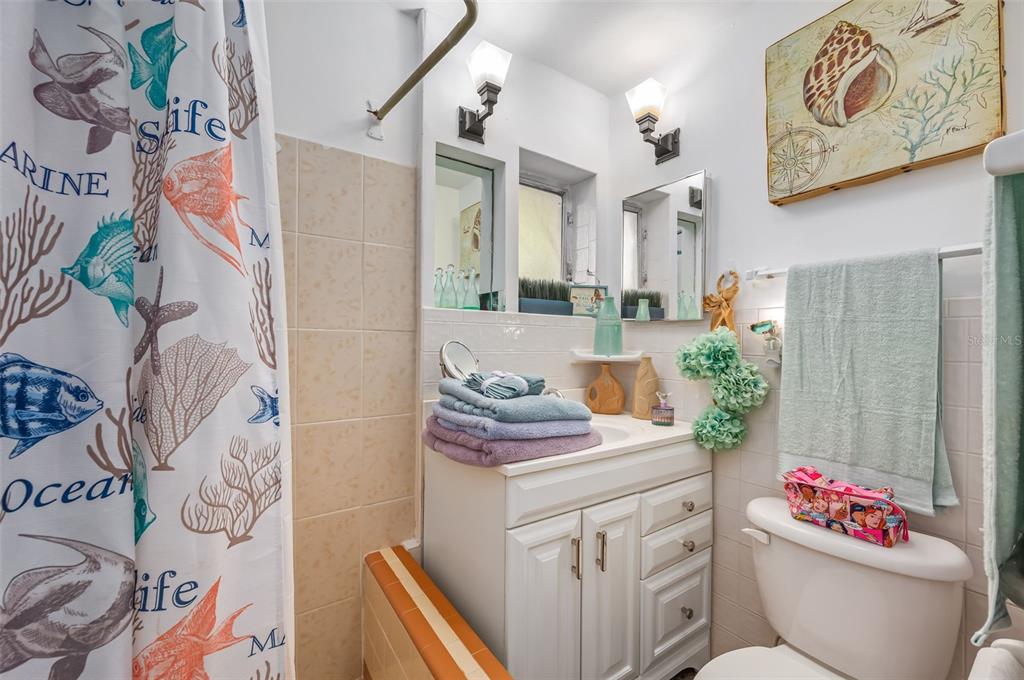 331 Hernando Street, Unit S 123 Fort Pierce, FL 34949 - Photo 32 of 52 a bathroom with a sink toilet and shower