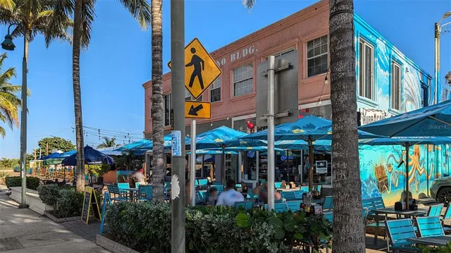 a front view of a building with sitting area