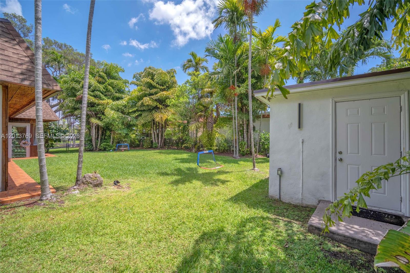 470 Northeast 113th Street, Unit 1 Miami, FL 33161 - Photo 47 of 56 a view of backyard with a garden and entertaining space