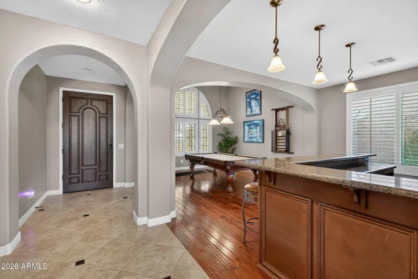 a workspace with wooden floor and a window