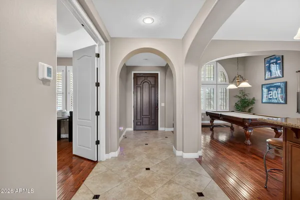 a workspace with wooden floor and windows