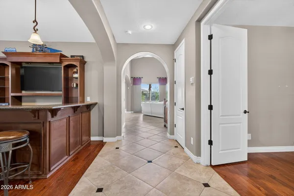 a living room with fireplace furniture and a large window