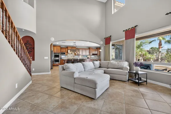 a kitchen with kitchen island granite countertop wooden cabinets stainless steel appliances a sink and a center island