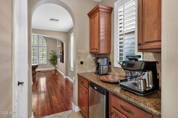 a view of a kitchen with furniture and floor to ceiling window