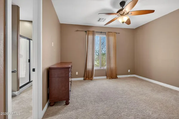 a view of room with window and cabinet