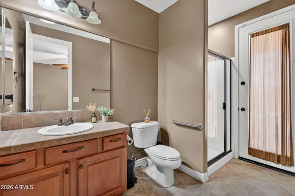 a bathroom with a sink a mirror and a window