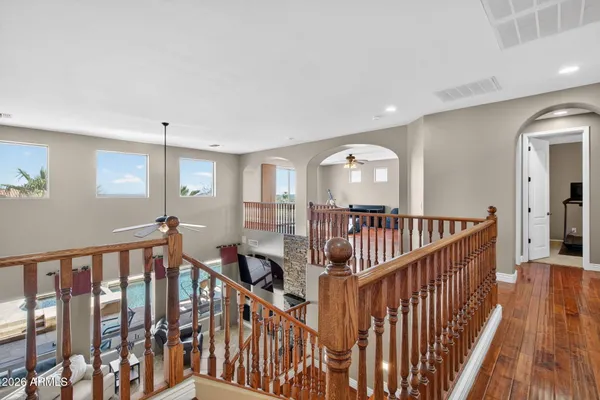 a bathroom with a granite countertop sink and a toilet