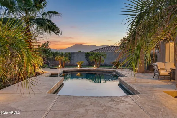 a living room with furniture a fireplace and a large window