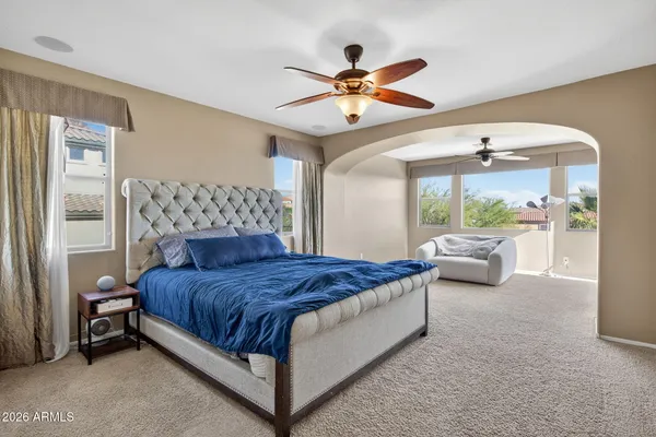 a bathroom with a granite countertop bathtub sink and mirror
