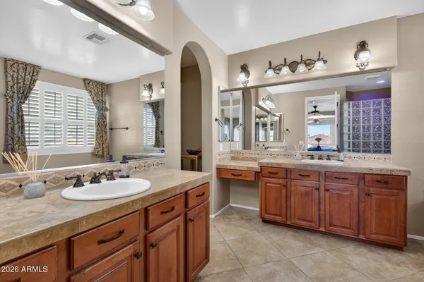 a view of walk in closet with clothes