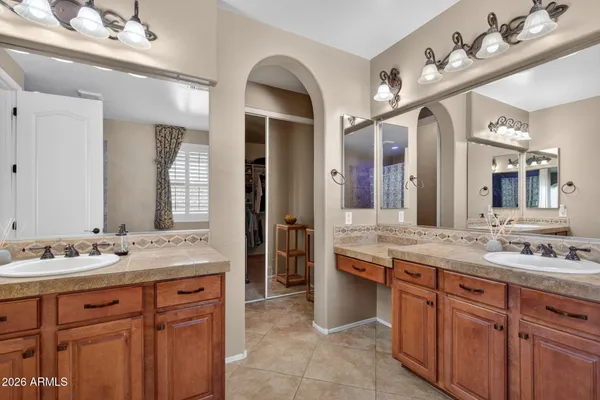 a dining room with furniture and a floor to ceiling window