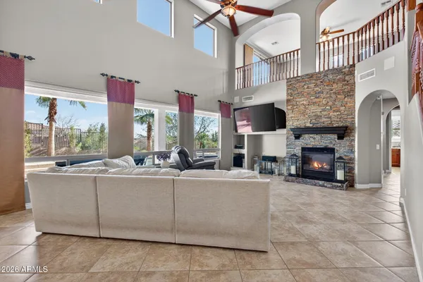 a room with pool table windows and wooden floor