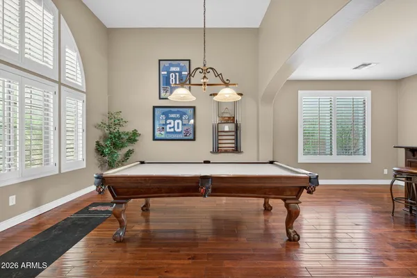 a view of a kitchen and dining room with wooden floor