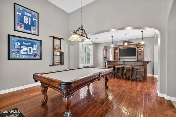 a lobby with furniture and wooden floor