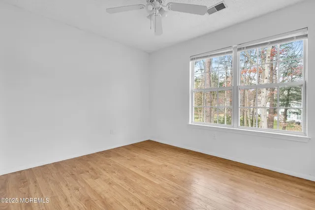 a white bath tub sitting next to a window