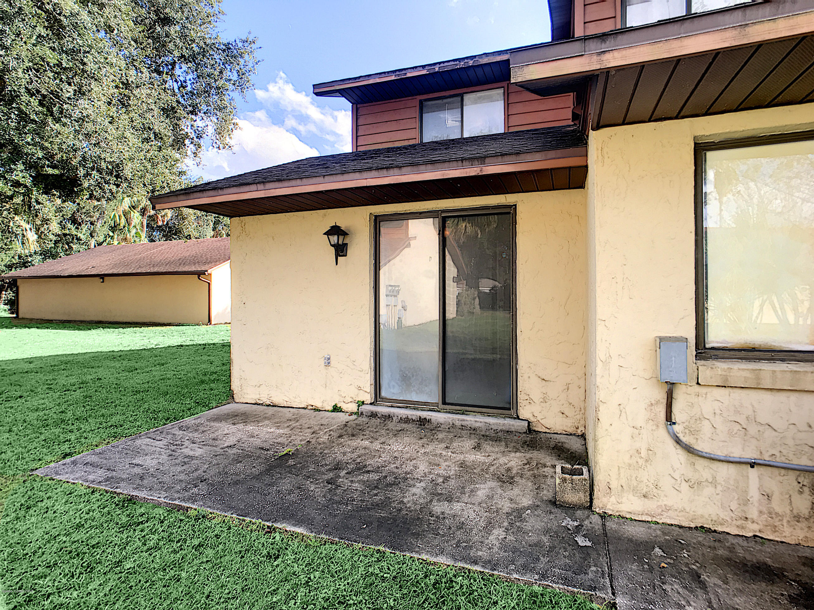 1120 Gary Hunt Road, Unit 3D Cocoa, FL 32926 - Photo 15 of 16 Back patio