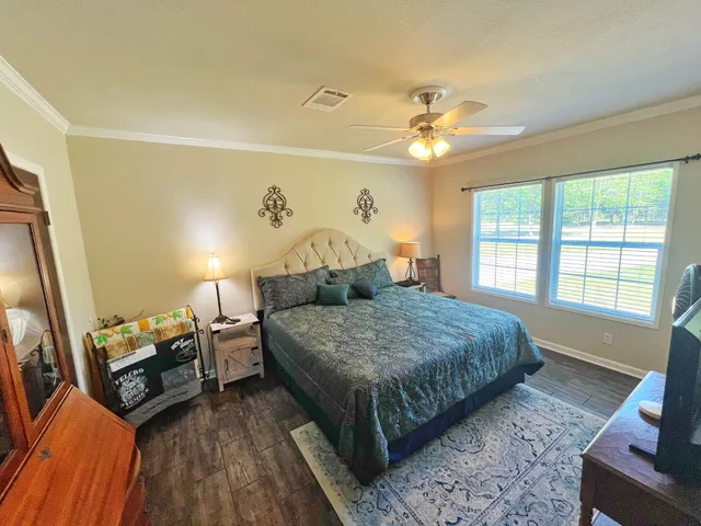 a en suite bathroom with a double vanity sink a mirror and a shower