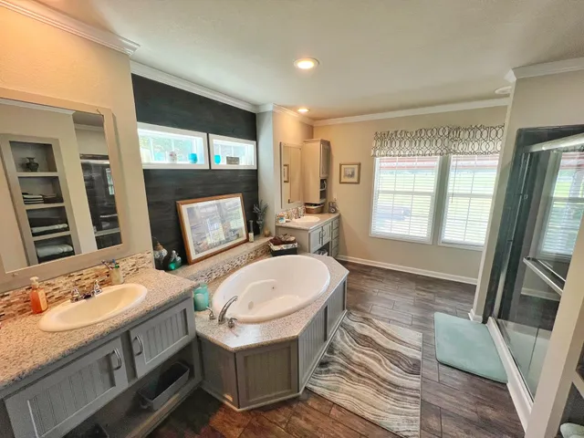 a living room with lots of furniture and a wooden floor