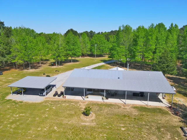 an aerial view of a house with pool