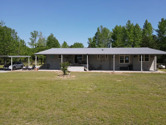 a view of a house with a swimming pool