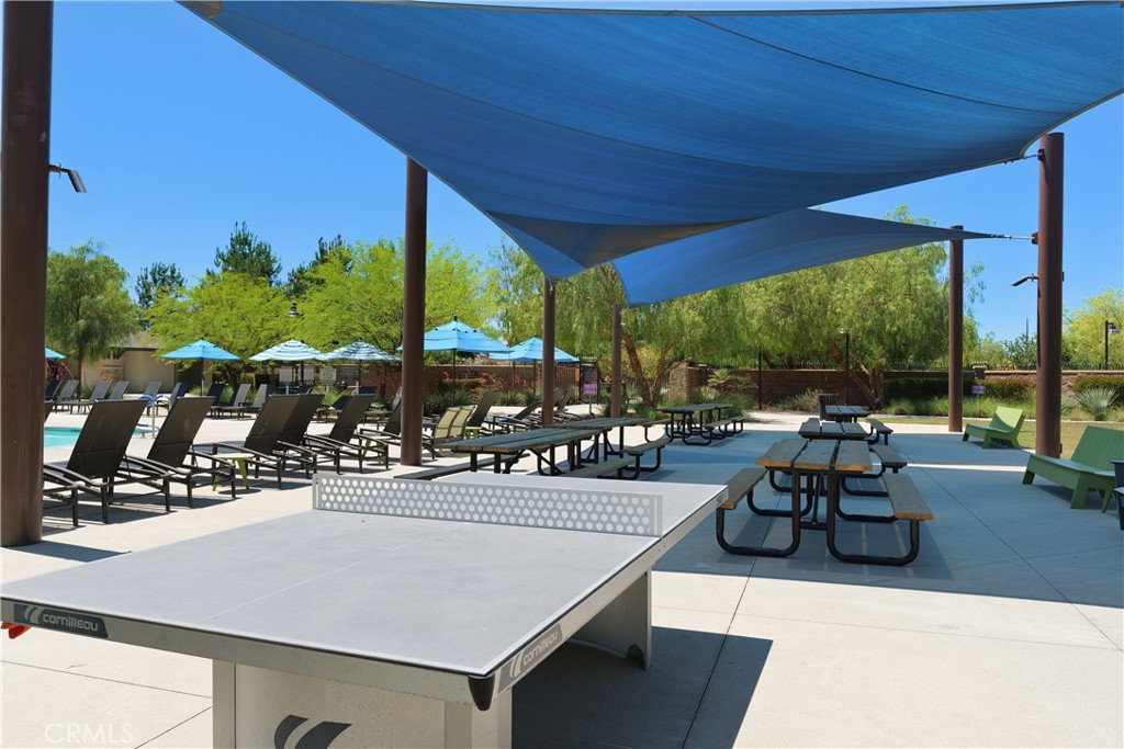 34727 Ribbon Grass Way Murrieta, CA 92563 - Photo 37 of 54 The Oasis is where Spencer’s Crossing comes to life—residents gather across expansive sun decks for relaxed afternoons in the sun, while shaded, covered picnic areas invite easy meals, conversation, and connection. Nearby, a dedicated ping pong space adds a playful, social touch, making it a true year-round hub for both leisure and community.