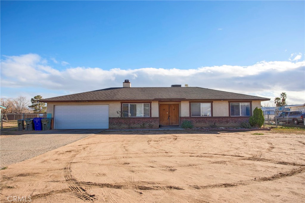 22231 Gayhead Road Apple Valley, CA 92307 - Photo 1 of 1 a front view of a house with a yard