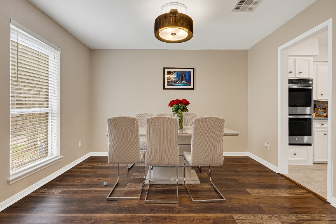 14724 Perthshire Road, Unit C Houston, TX 77079 - Photo 4 of 29 Formal dining room with beautiful wood floors.