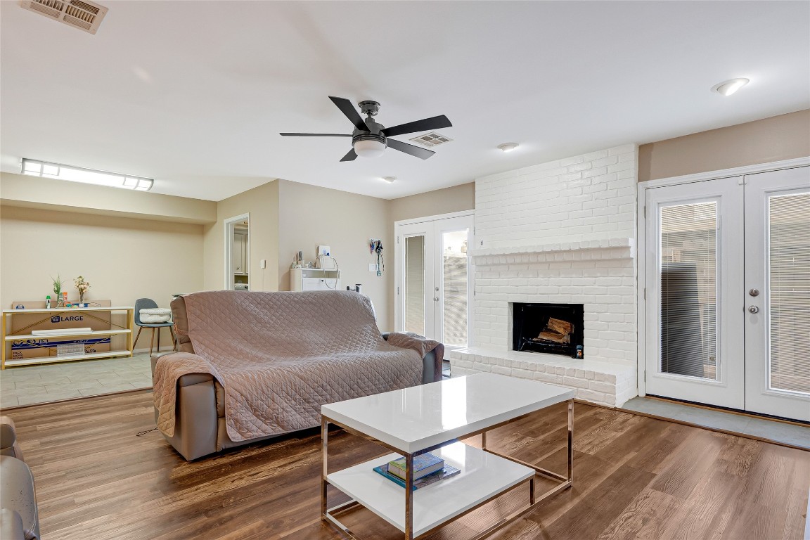 14724 Perthshire Road, Unit C Houston, TX 77079 - Photo 10 of 29 Wood burning fireplace and easy to maintain floors.