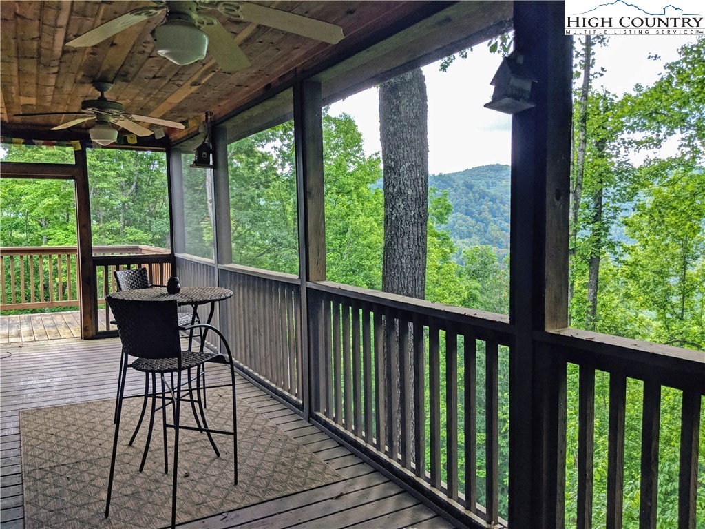 375 Deer Run Road Deep Gap, NC 28618 - Photo 22 of 44 a view of a chairs and table in the balcony