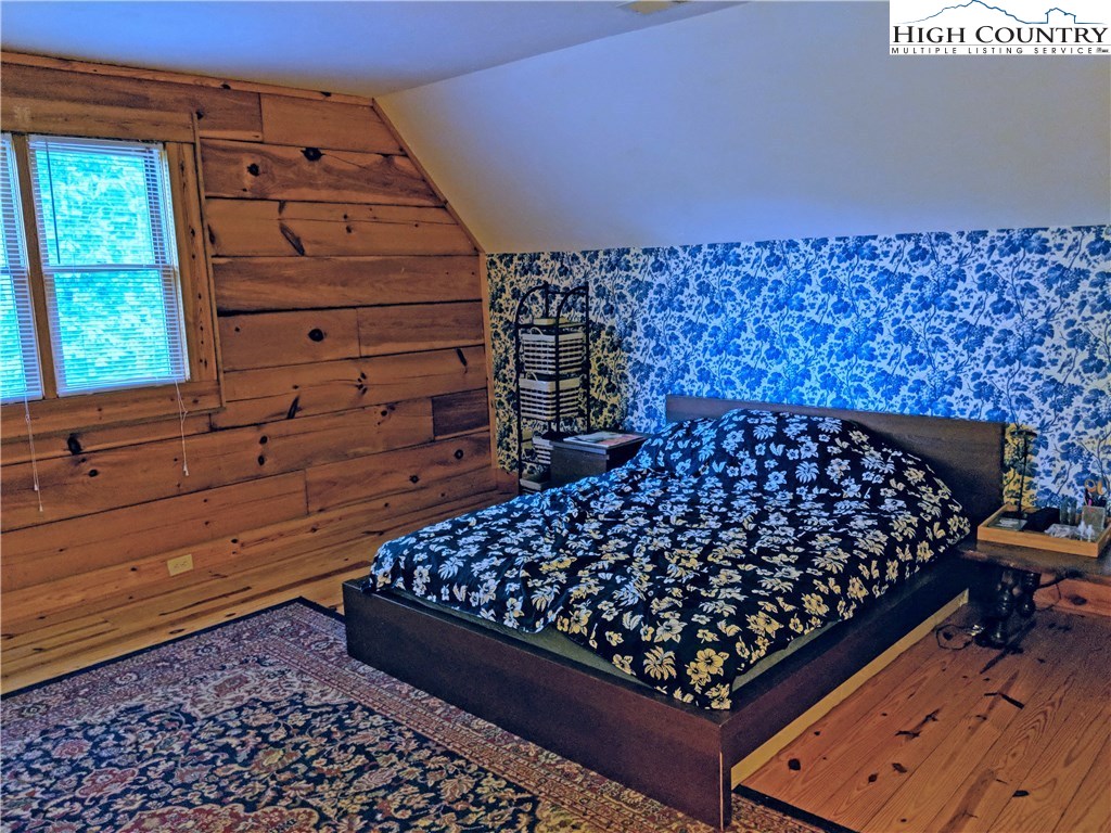 375 Deer Run Road Deep Gap, NC 28618 - Photo 23 of 44 a bed room with a bed and a window