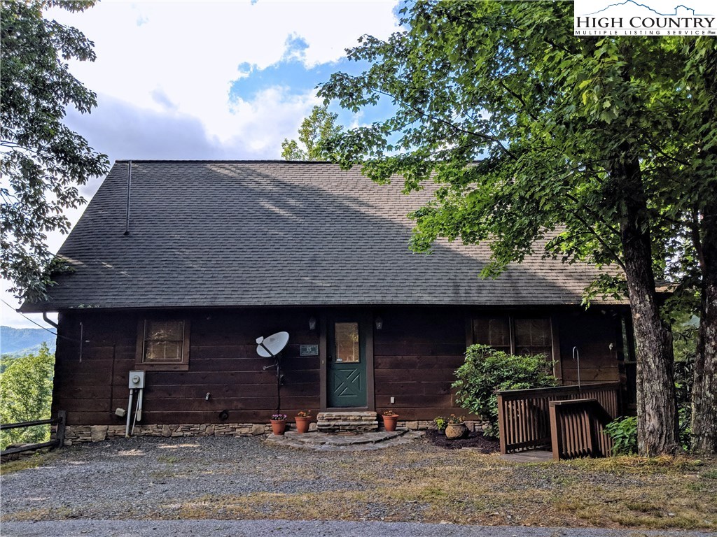 375 Deer Run Road Deep Gap, NC 28618 - Photo 5 of 44 a front view of a house with garden