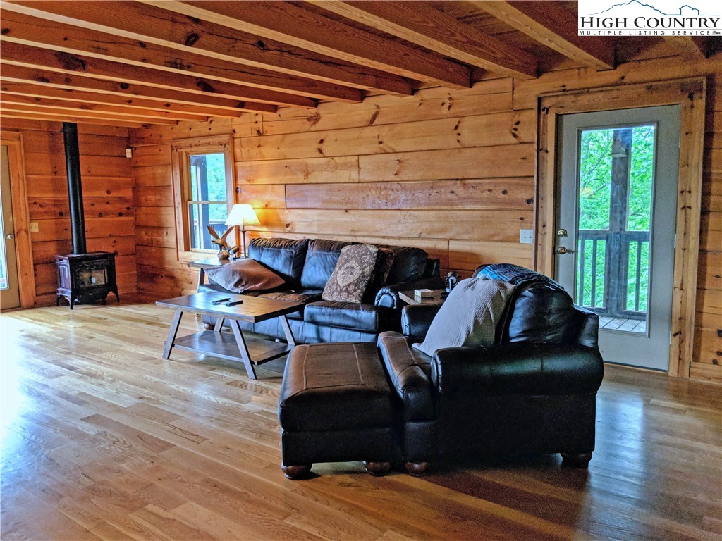 375 Deer Run Road Deep Gap, NC 28618 - Photo 7 of 44 a living room with furniture and wooden floor