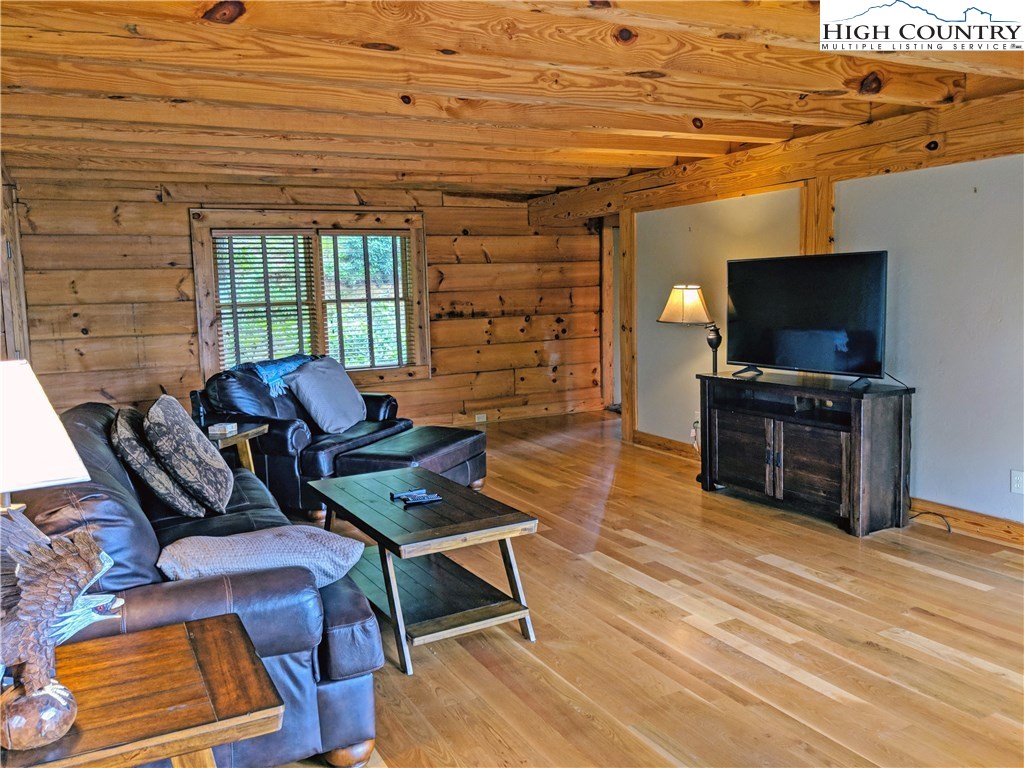 375 Deer Run Road Deep Gap, NC 28618 - Photo 8 of 44 a living room with furniture and a flat screen tv