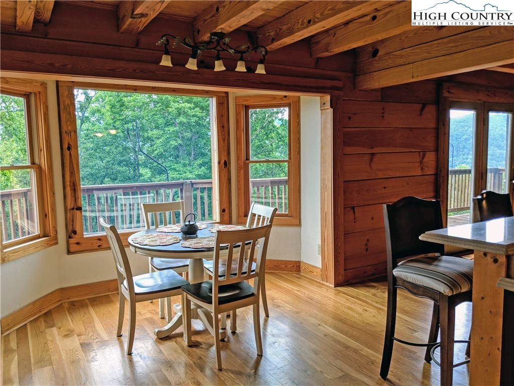 375 Deer Run Road Deep Gap, NC 28618 - Photo 10 of 44 a dining room with furniture and wooden floor