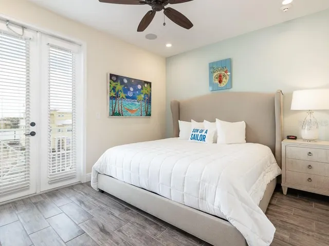 a bathroom with a granite countertop sink a toilet and a mirror