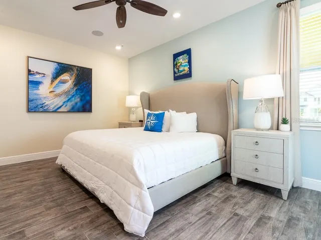 a bathroom with a tub a sink and a mirror