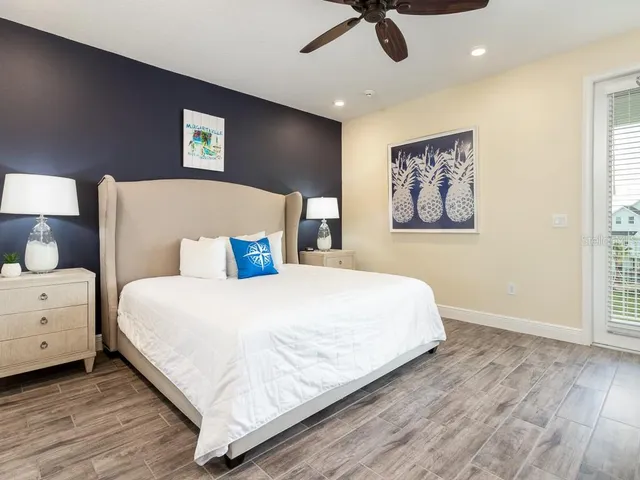 a bedroom with a large bed and a window