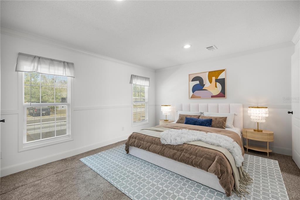 1550 Northeast 162nd Street Citra, FL 32113 - Photo 14 of 33 a bedroom with a bed and a window