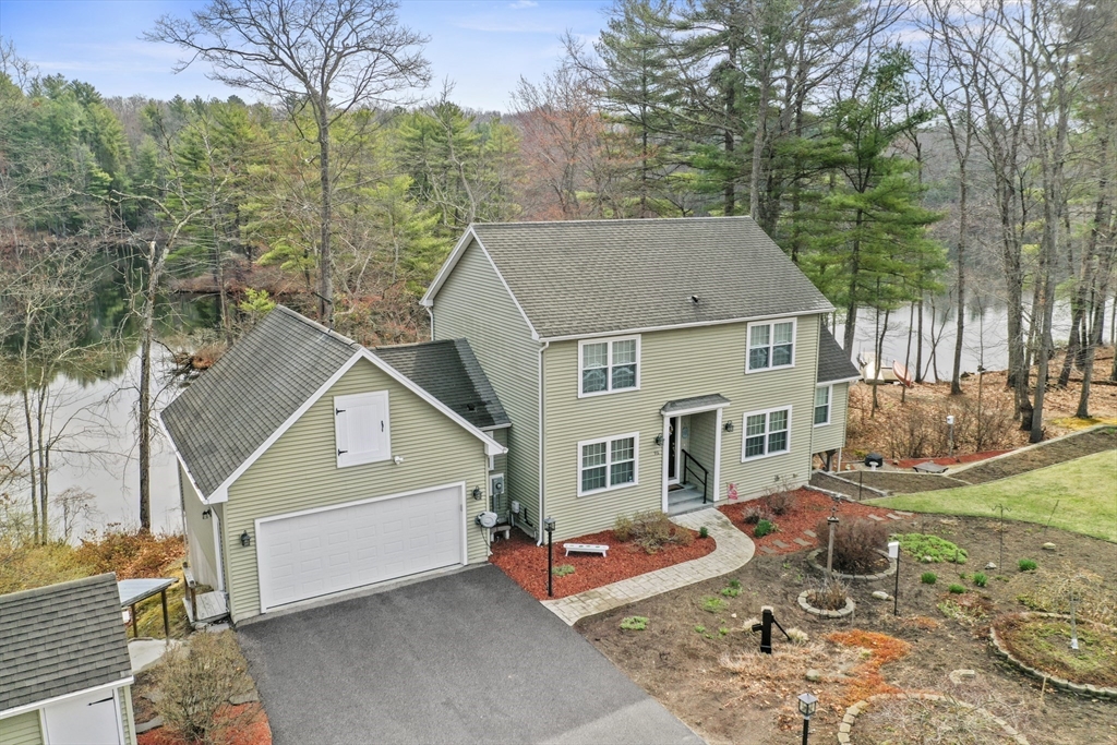 96 Pierpont Road Dudley, MA 01571 - Photo 1 of 42 an aerial view of a house with swimming pool and furniture