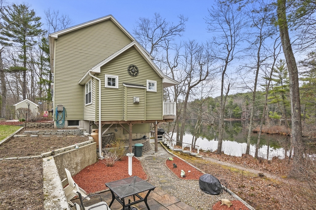 96 Pierpont Road Dudley, MA 01571 - Photo 35 of 42 a view of a house with backyard and sitting area