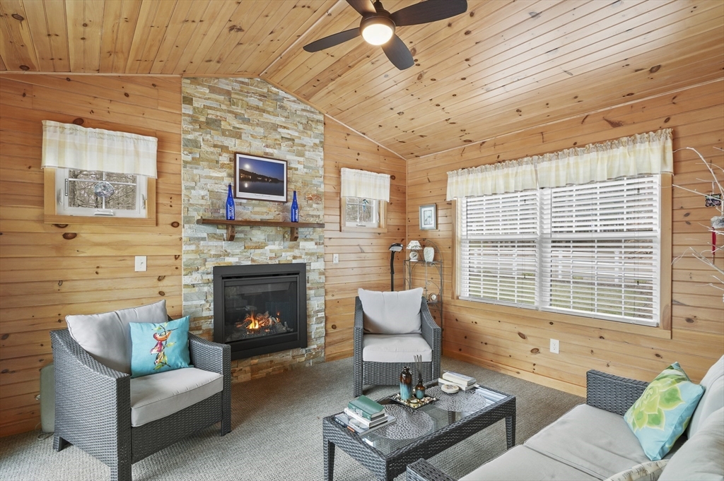 96 Pierpont Road Dudley, MA 01571 - Photo 6 of 42 a living room with furniture a fireplace and a table