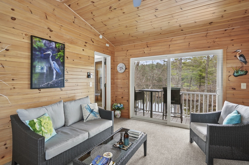 96 Pierpont Road Dudley, MA 01571 - Photo 8 of 42 a living room with furniture and a floor to ceiling window