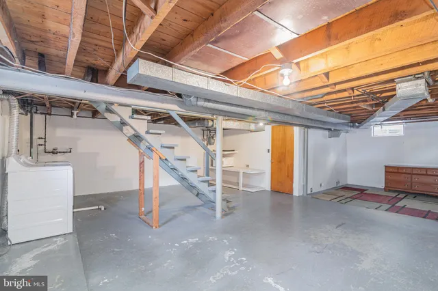 a view of an empty room with stairs