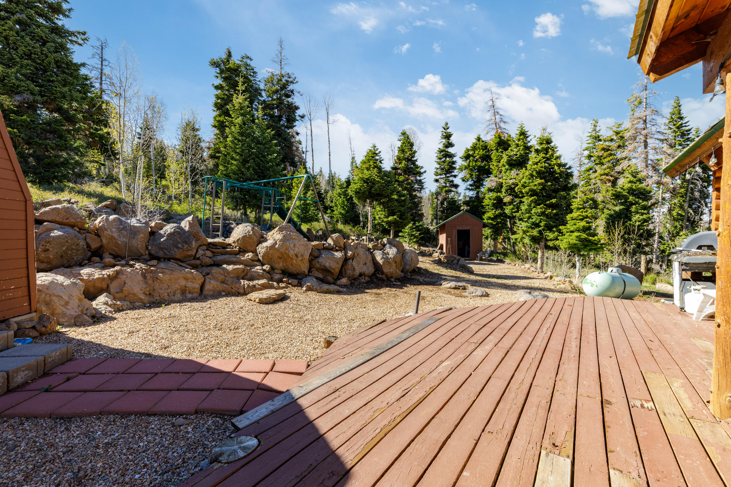 706 West Tranquility Drive Springdale, UT 84767 - Photo 24 of 58 Private Backyard Space: View of the leveled grounds and surrounding pine forest.
